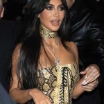 Kim Kardashian lace-up gown causes stair fatigue